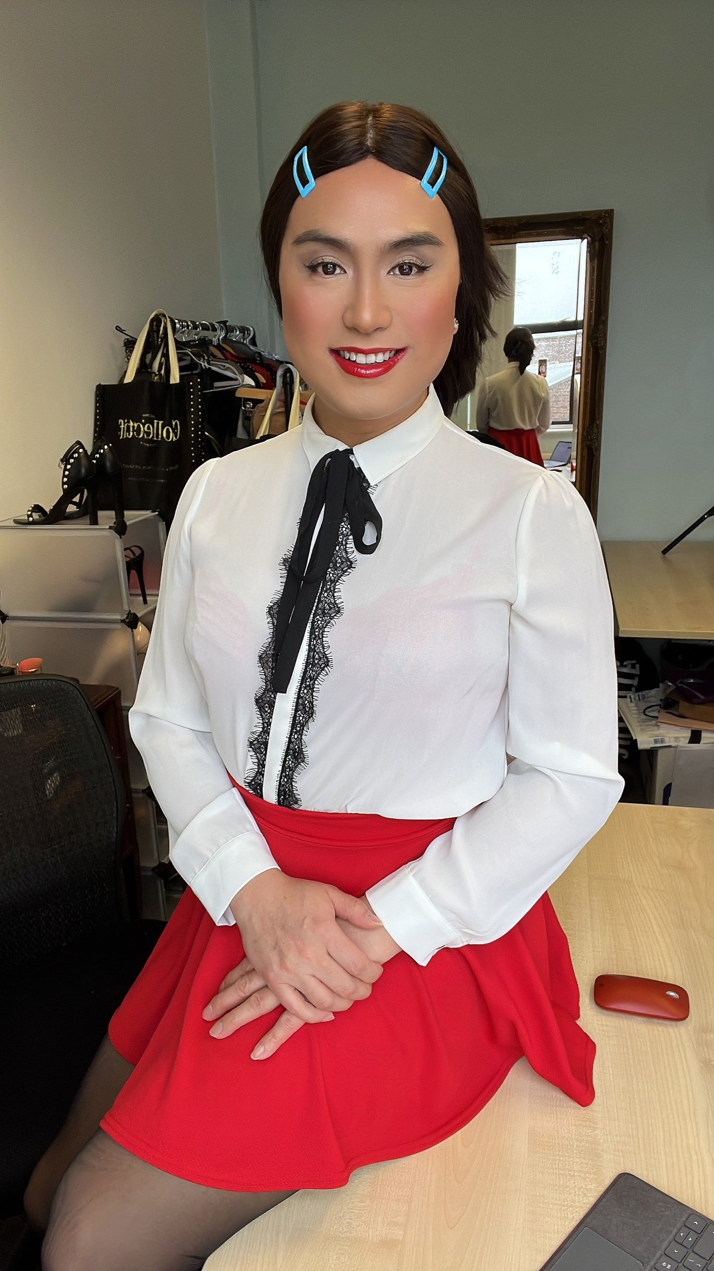 White sheer blouse and red skirt