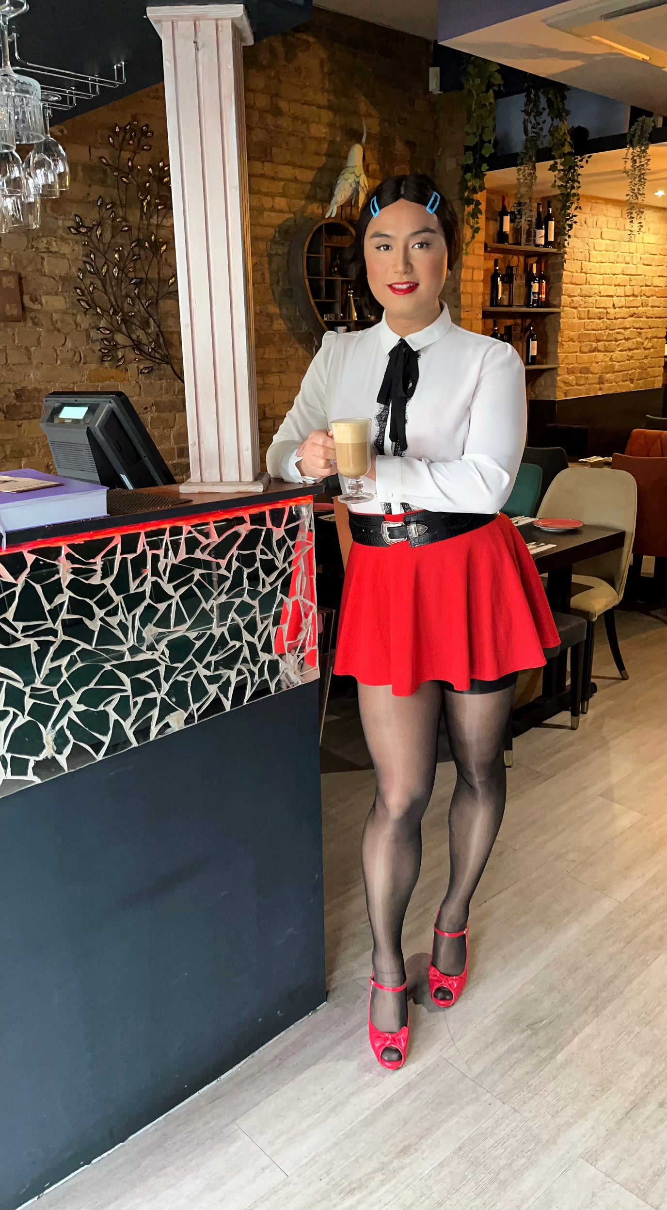 White sheer blouse and red skirt